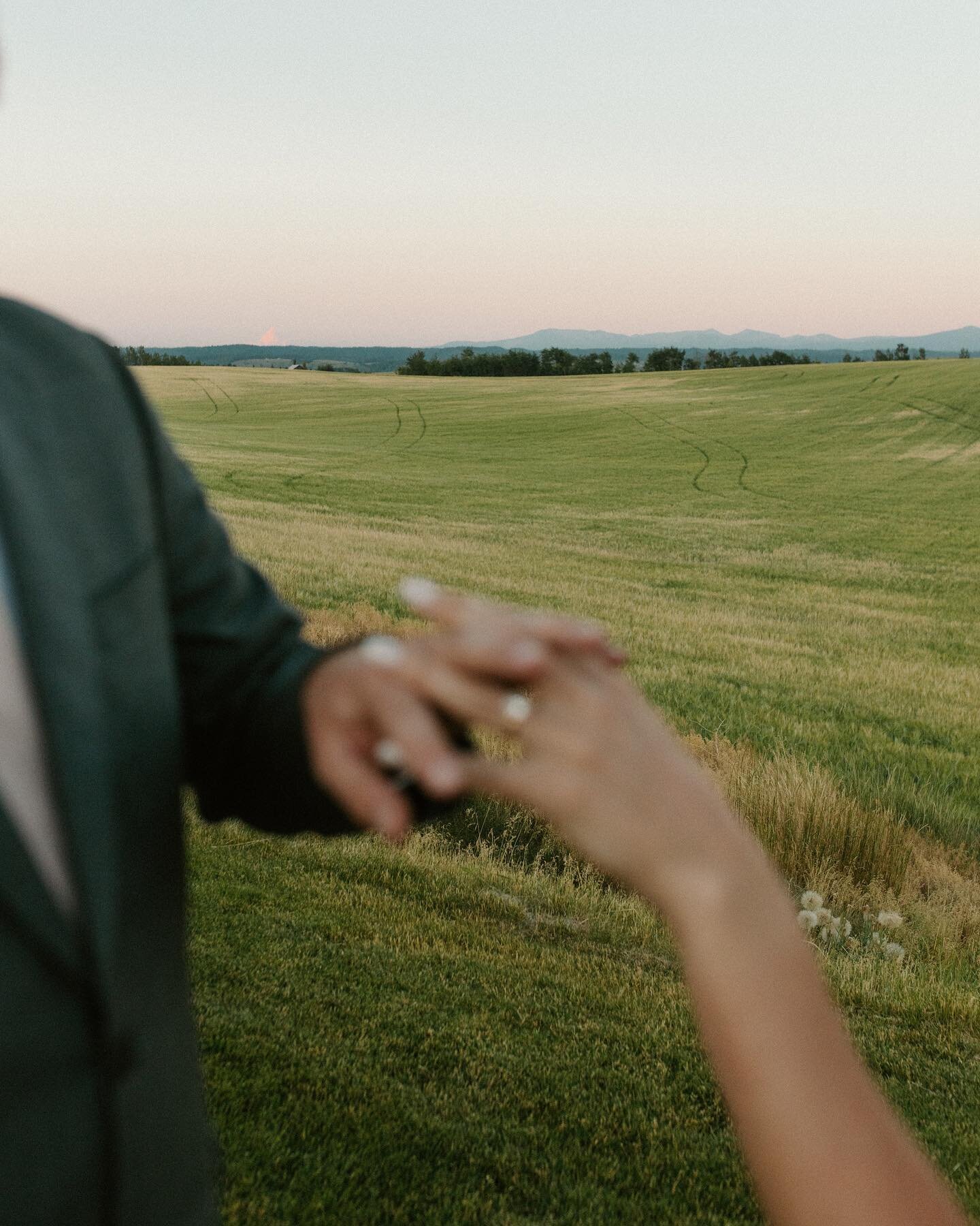 sneaking away for sunset photos is one of my favorite parts of a wedding day&mdash;especially when it involves green rolling hills and a glowing sky over the tetons in the distance ✨