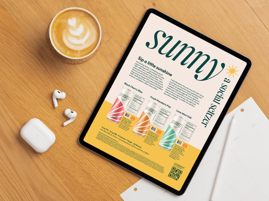 Tablet displaying a Sunny seltzer flyer on a wooden desk alongside a cup of coffee, wireless earbuds, their case, and some papers.