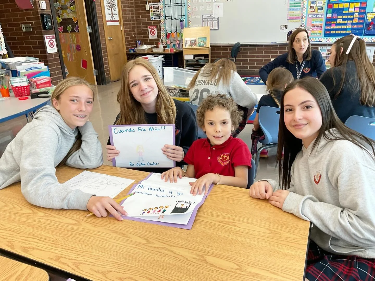 In Spanish, our 8th graders created books about their kindergarten buddies and read them together&mdash;learning, laughter, and connection all in one!