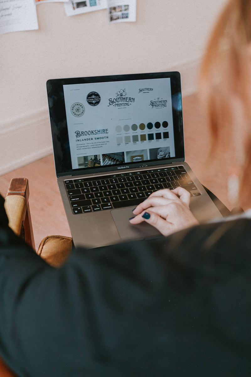 Person using a MacBook Pro laptop, browsing the branding Mallisa, founder of Kindred Creative has created
