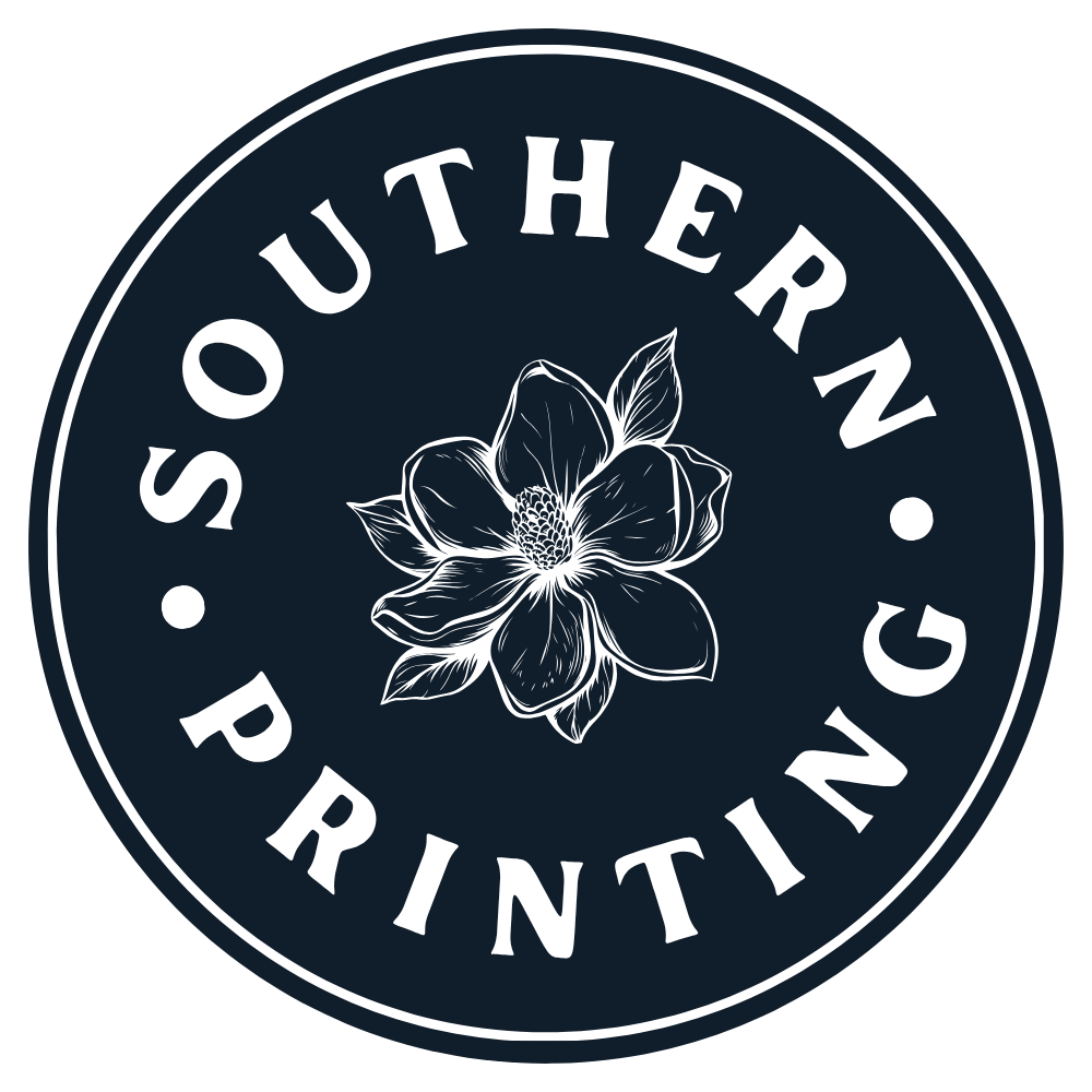 A circular logo with the text 'Southern Printing' around the border and a white outline of a flower in the center on a dark background.