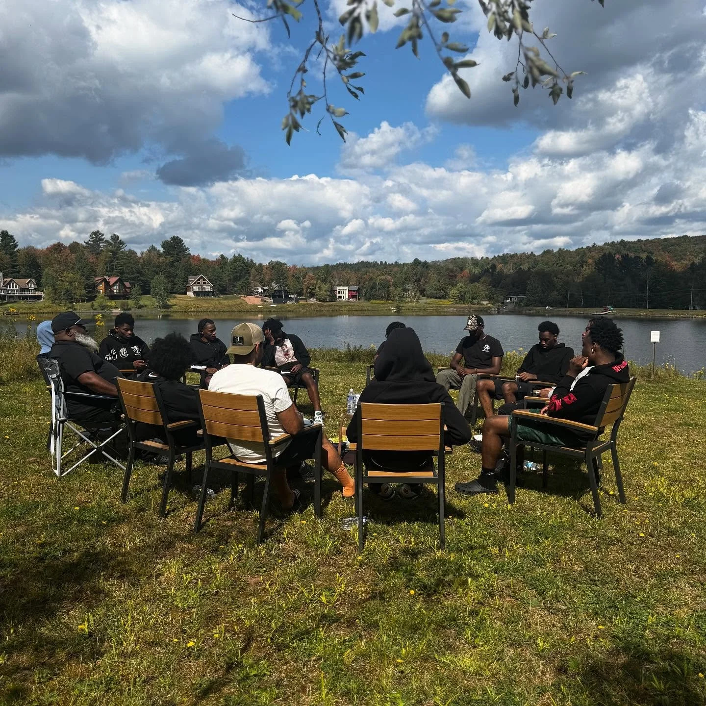 Day Two: Redefine & Retreat 🖤💙
Slide 1
🌱 A circle in the grass. Brothers. Coach Cooper. The quiet.
➡️ The work begins when we sit still.
Slide 2
Silence stretches. 🌿
Together + alone. Meditation isn’t escape it’s returning.
Sli