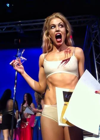 A Vancouver strip club dancer from The Granville Strip is given an award on stage