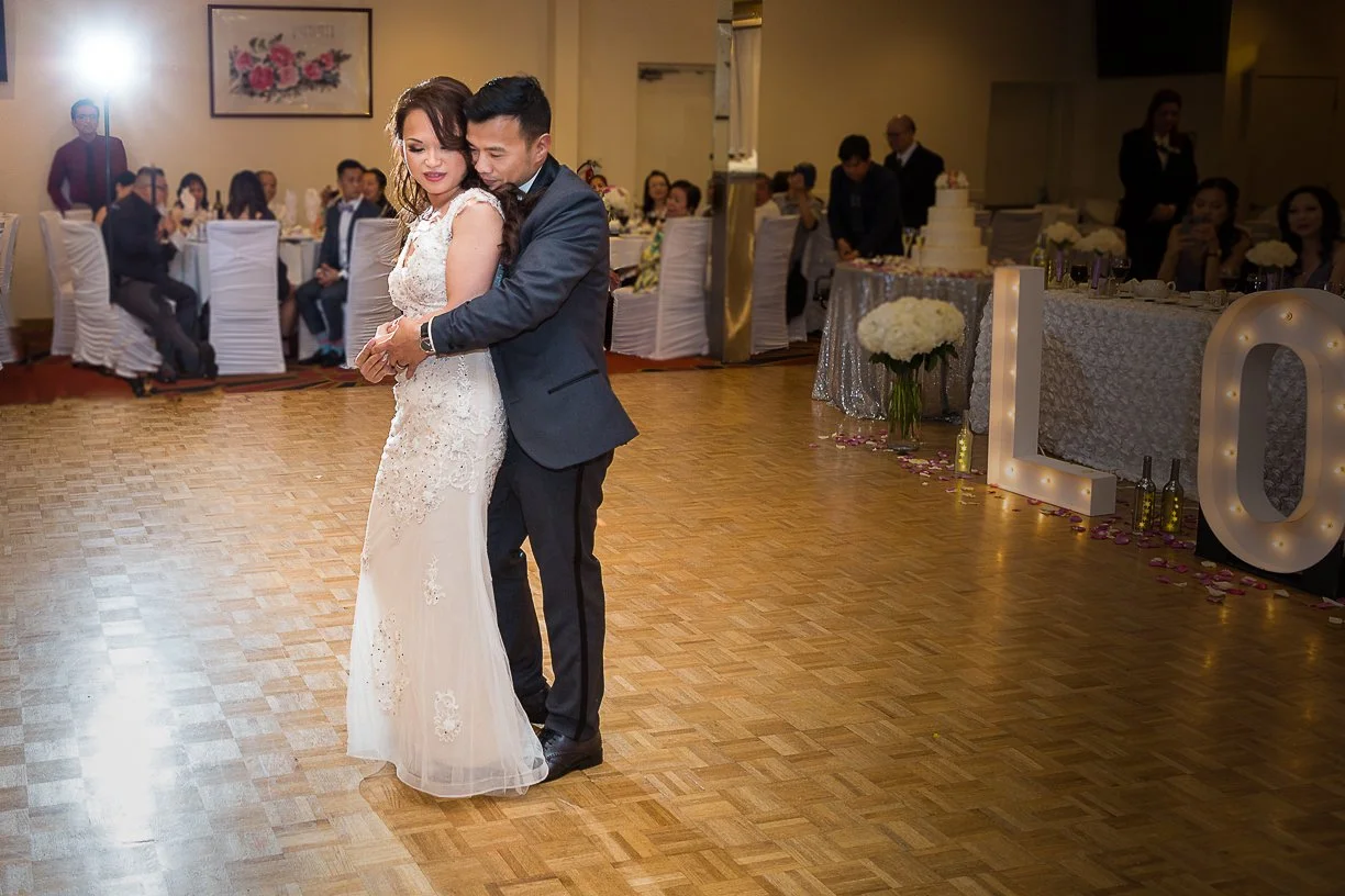 Bride and groom dancing at wedding reception