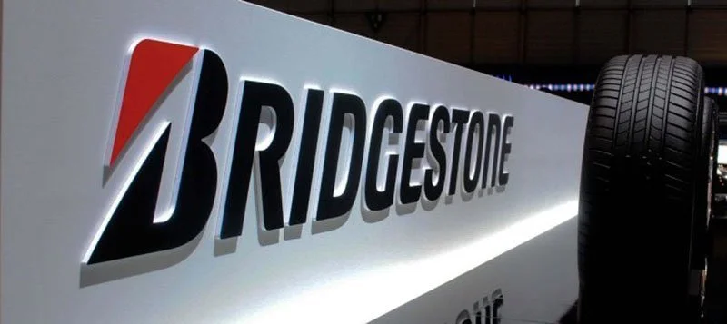 Close-up of a Bridgestone sign with a tire on the right side