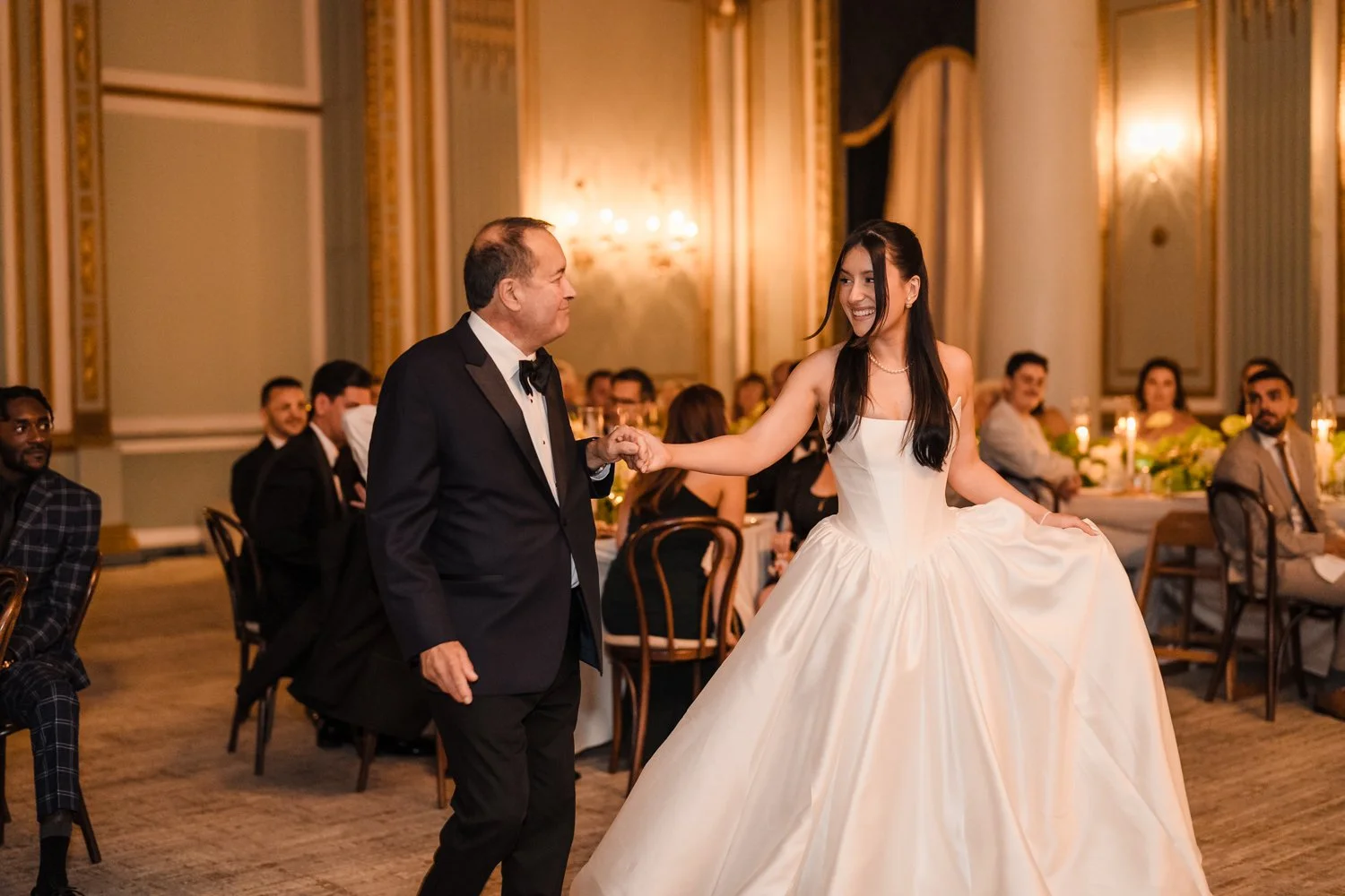 Bride shares an emotional father-daughter dance during the wedding reception at Le Windsor in Montreal, photographed in a documentary wedding photography style.