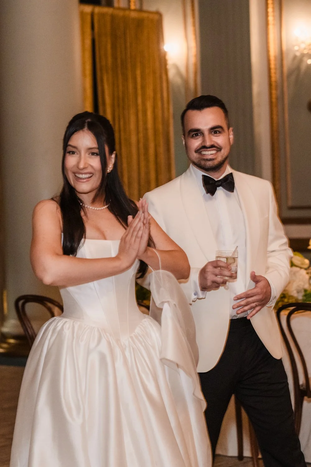 Candid moment of a bride and groom entering their wedding reception during a documentary-style wedding in Montreal.