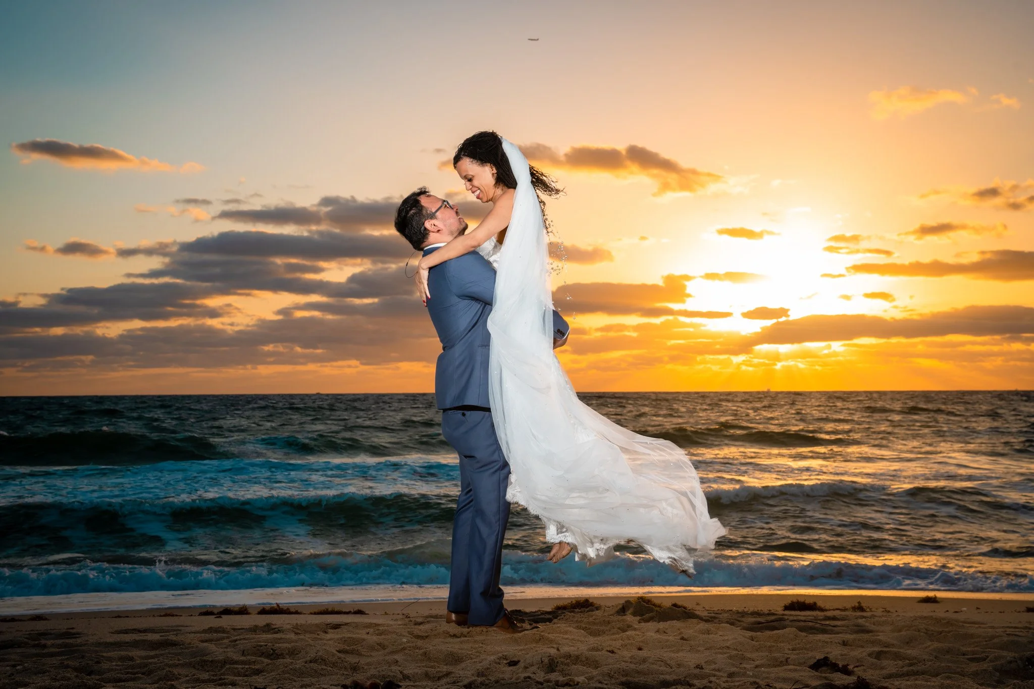 Candid sunset portrait of a newly married couple in Miami