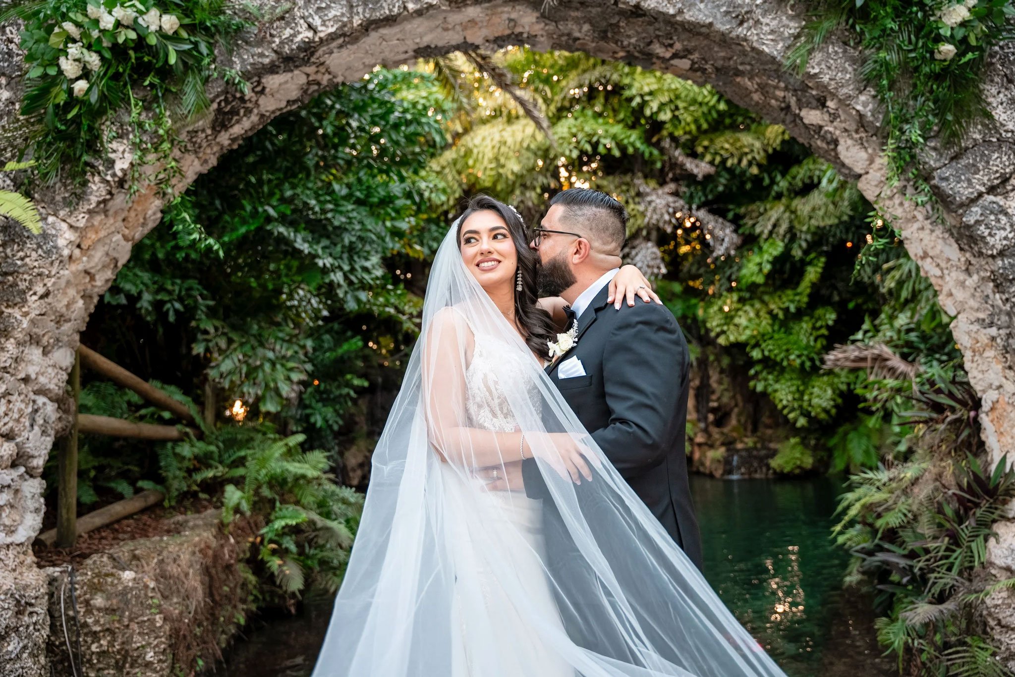Outdoor wedding ceremony surrounded by tropical plants at a Miami garden venue