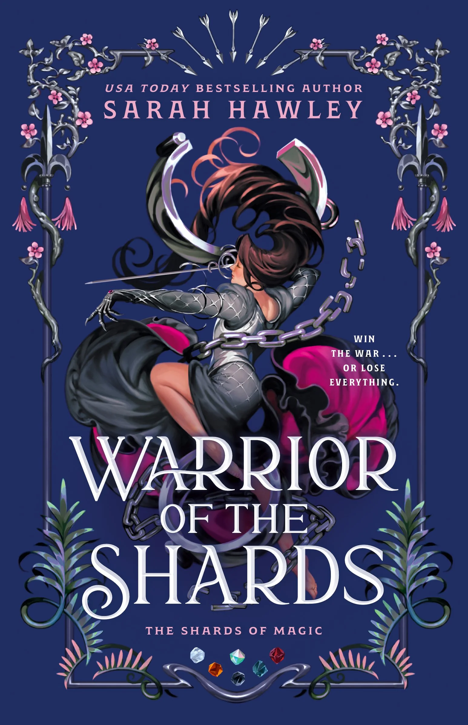 A purple cover with a silver border that includes weapons and pink flowers. The heroine wears a gray dress with pink lining and armor details and is carrying a sword. Broken manacles wind around her.