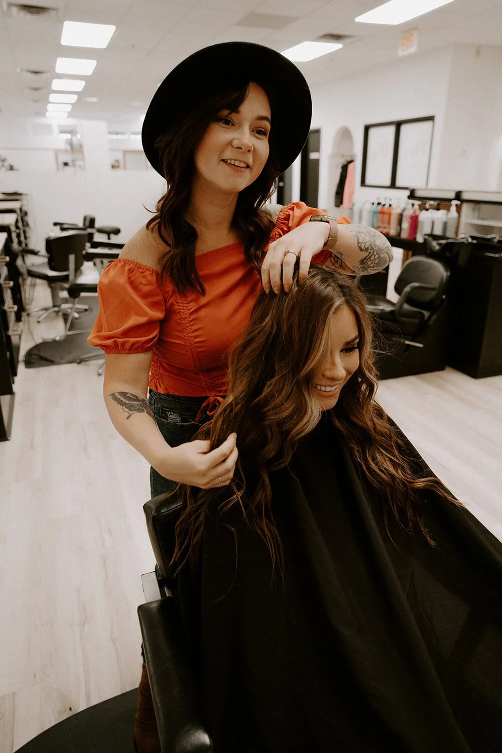 Hair stylist cutting and styling hair at Salt + Light Salon and Spa in Cincinnati, Ohio