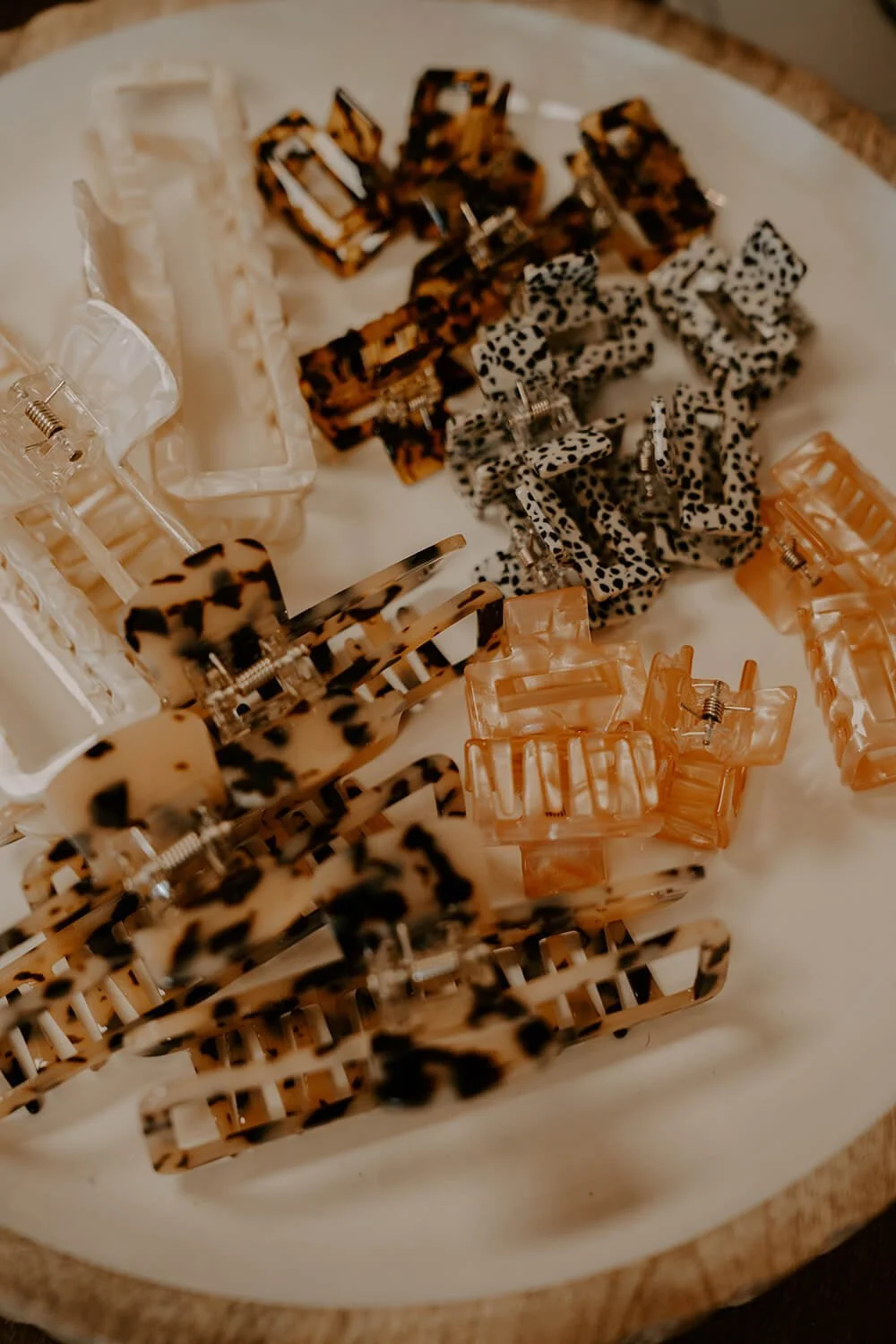 Collection of various patterned hair clips in different shapes and colors at the Shop Salt boutique.