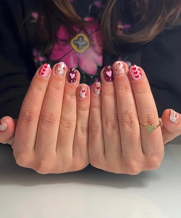 Custom nail design with hearts and polka dot designs done at Salt + Light Salon and Spa in Cincinnati, OH