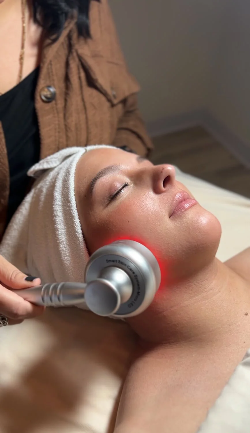 Esthetician doing LED Light Therapy facial at Salt + Light Salon and Spa in Cincinnati, Ohio