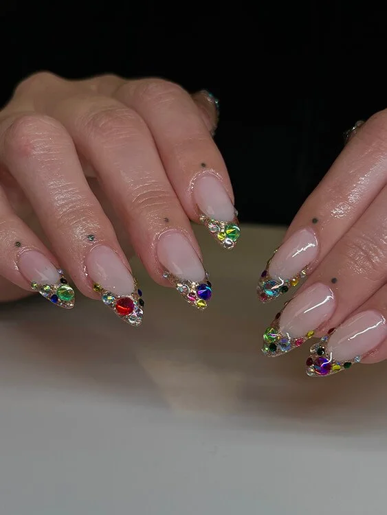 Custom nail design featuring rhinestones and colorful gemstones done at Salt + Light Salon and Spa in Cincinnati, OH
