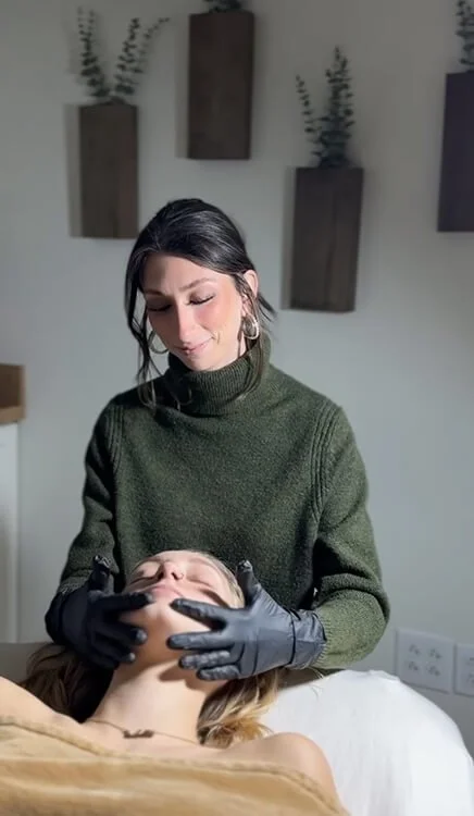 Woman getting facial at Salt + Light Salon and Spa in Cincinnati, Ohio