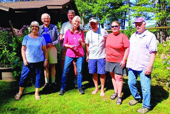 Shauna Kondrat (center) receives the Morten Award surrounded by members of the Big Pea Porridge Pond Watershed Preservation Association Board of Directors.