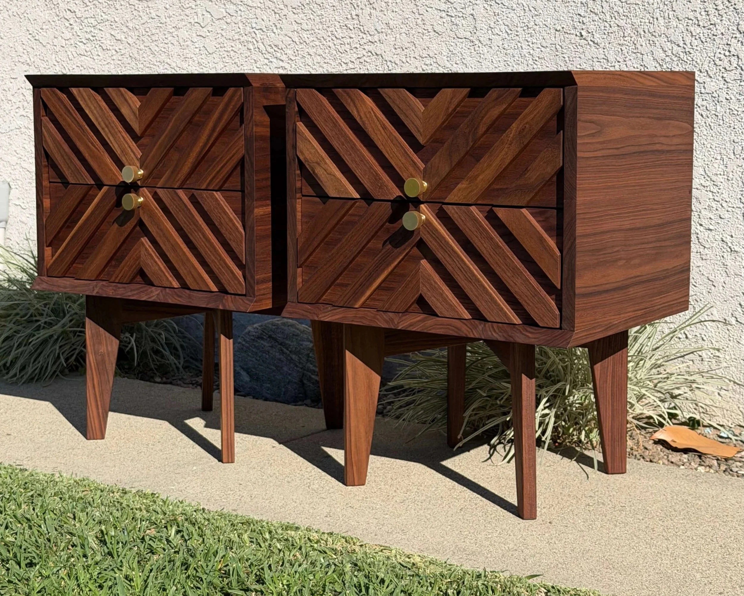 Mid-century inspired nightstands. Walnut bodies with poplar drawers and wood-on-wood sliders.