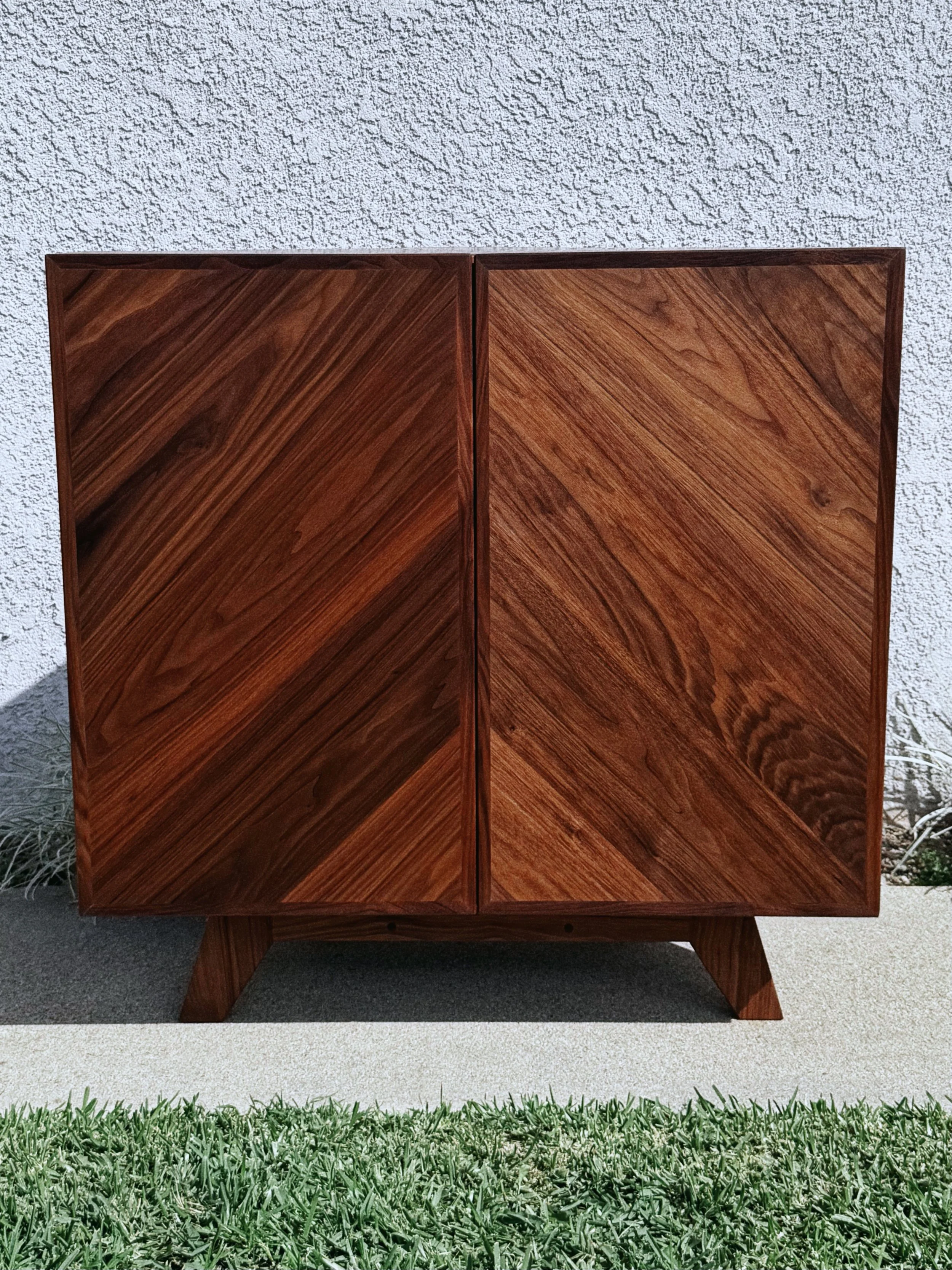 Mid-century inspired corner cabinet.