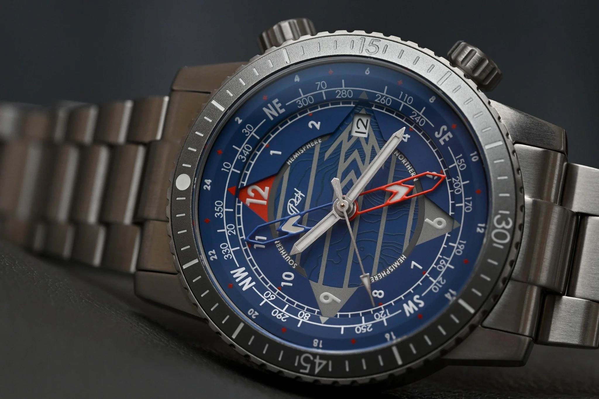 Up close and personal with the Horizon Blue. 🔎

When you look at the Lark from a distance, it&rsquo;s a highly capable True GMT. But get up close, and that multi-layered dial reveals a topographic map texture designed for a subtle pop of story in th