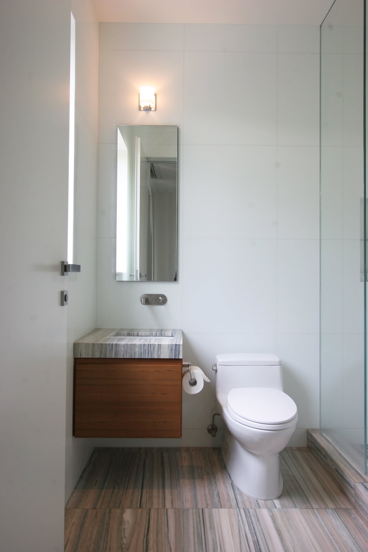 Simple Guest Bathroom with custom teak vanity