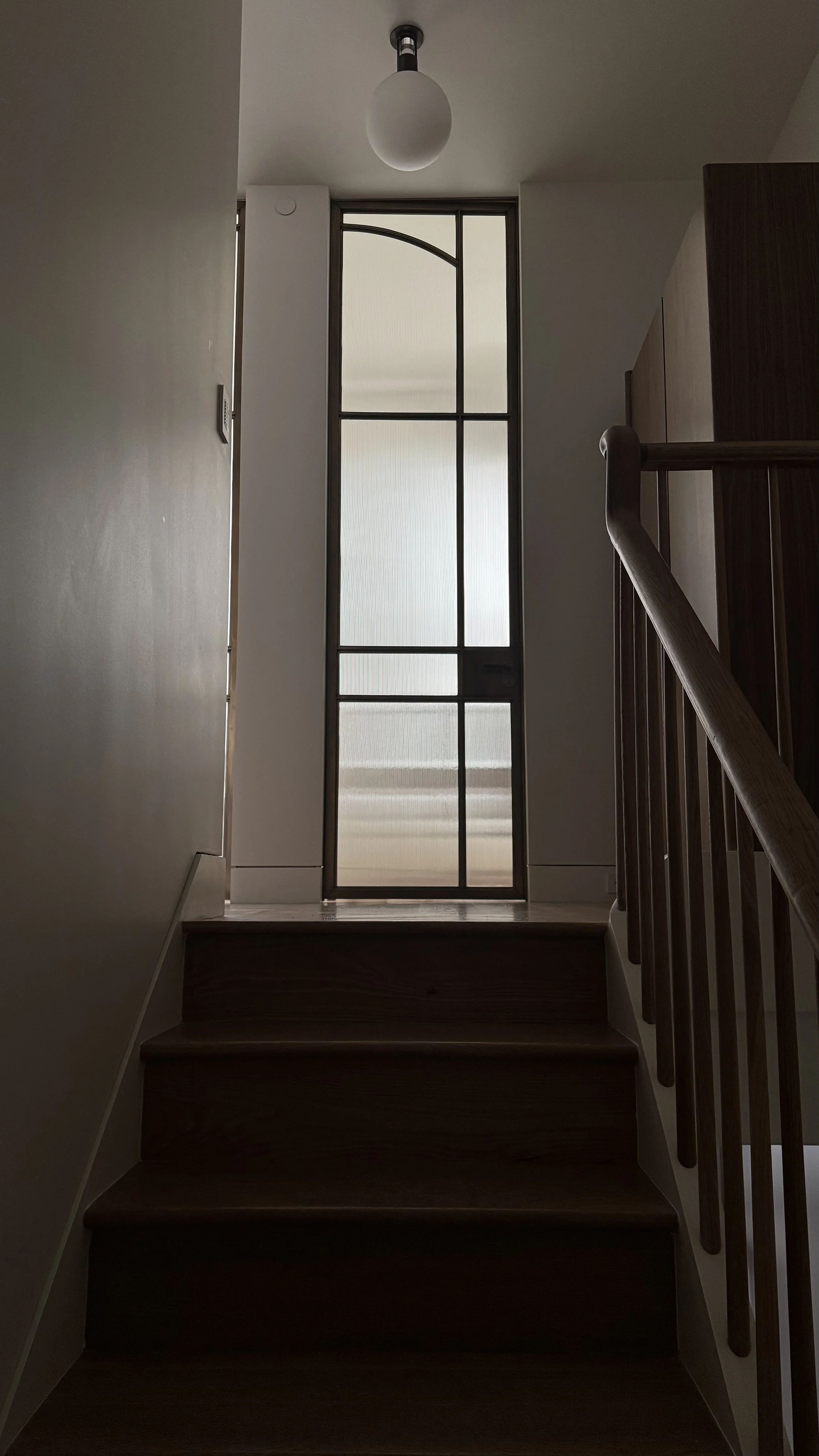 BRONZE AND FLUTED GLASS DOOR