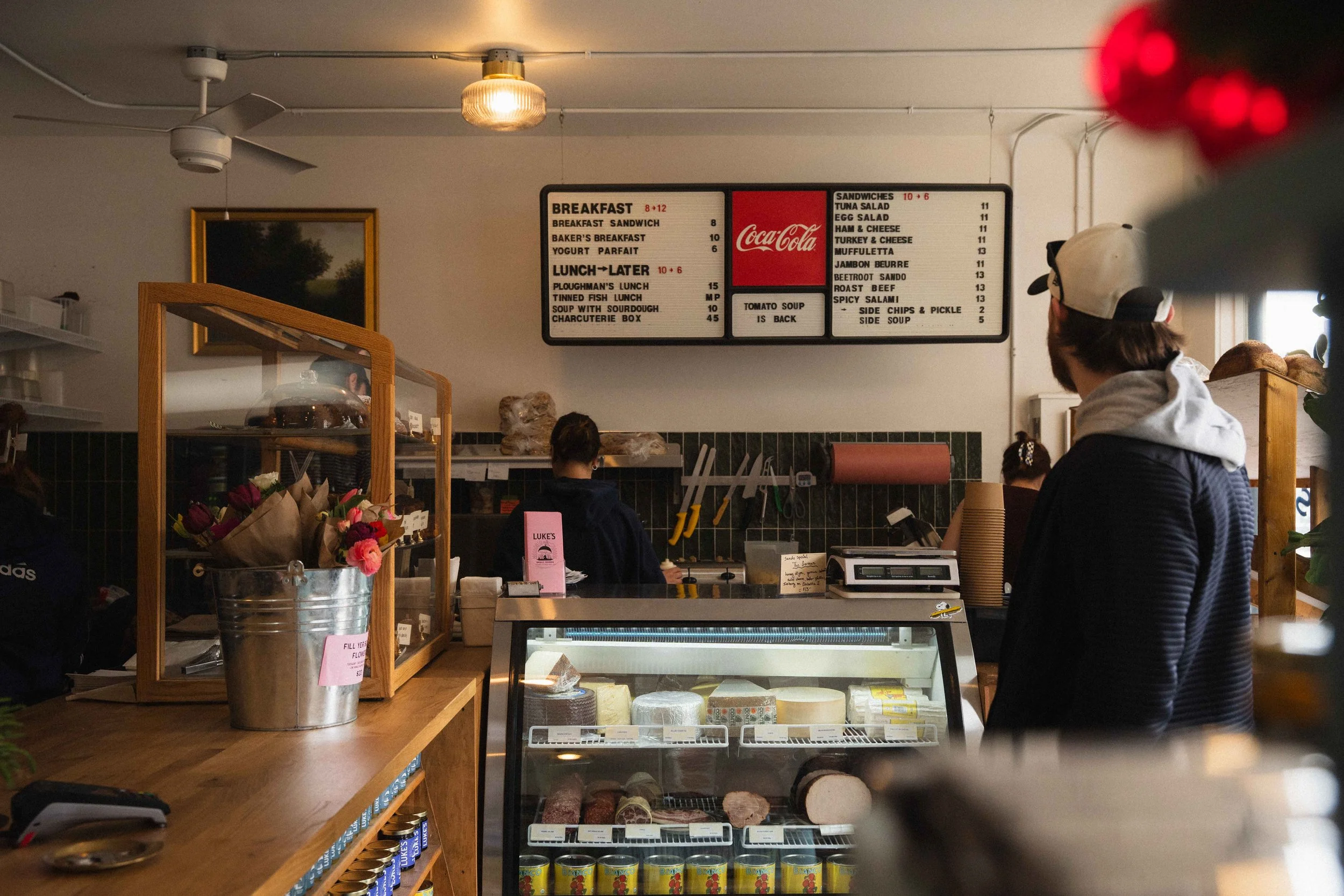 interior shot of Luke's Small Goods in Halifax's North End, a trendy local lunch place and sandwich shop with artisan bread in the windows and vintage sandwich board