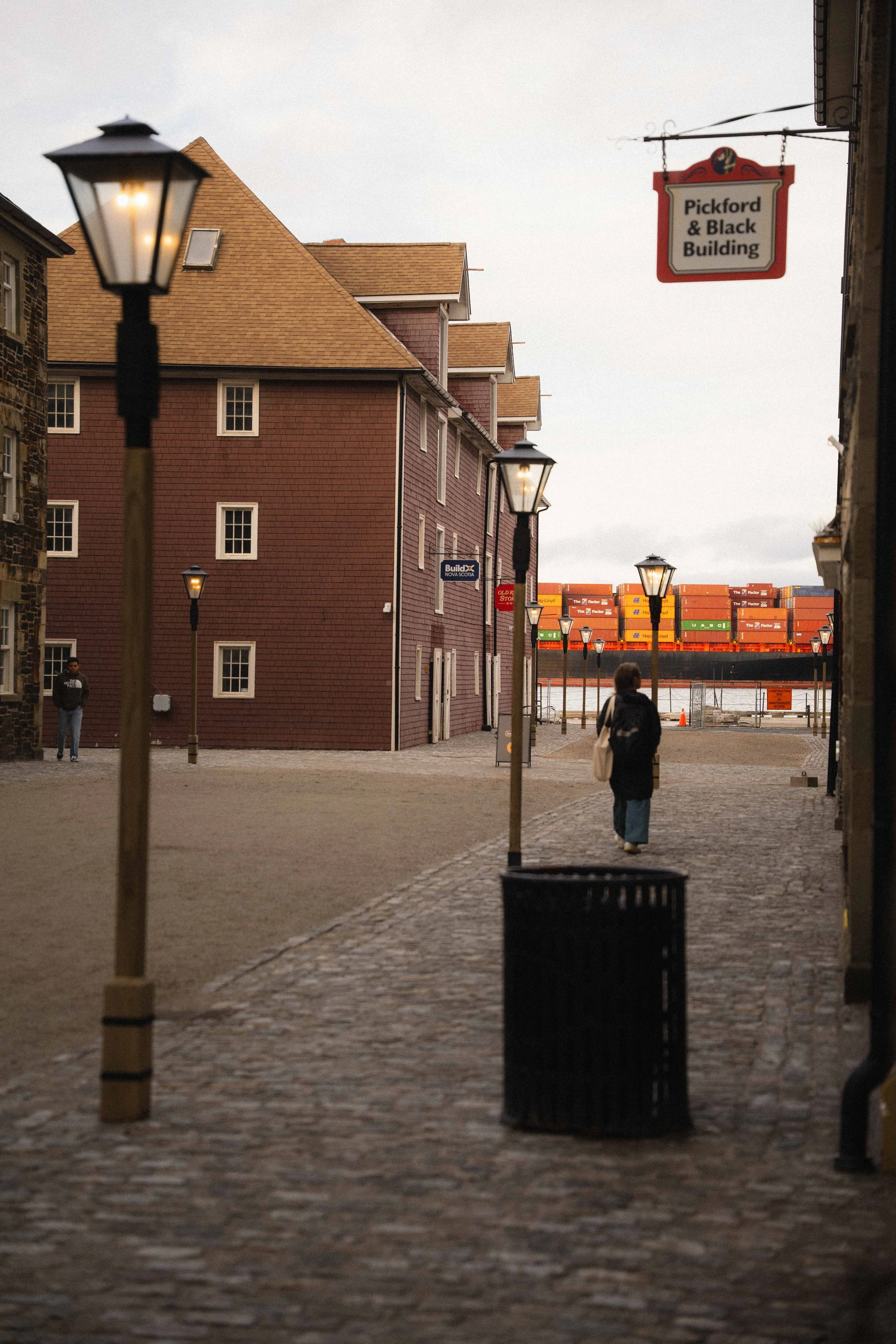 Historic Halifax Waterfront with cargo ship floating by in the harbour, a guide to third spaces in the city