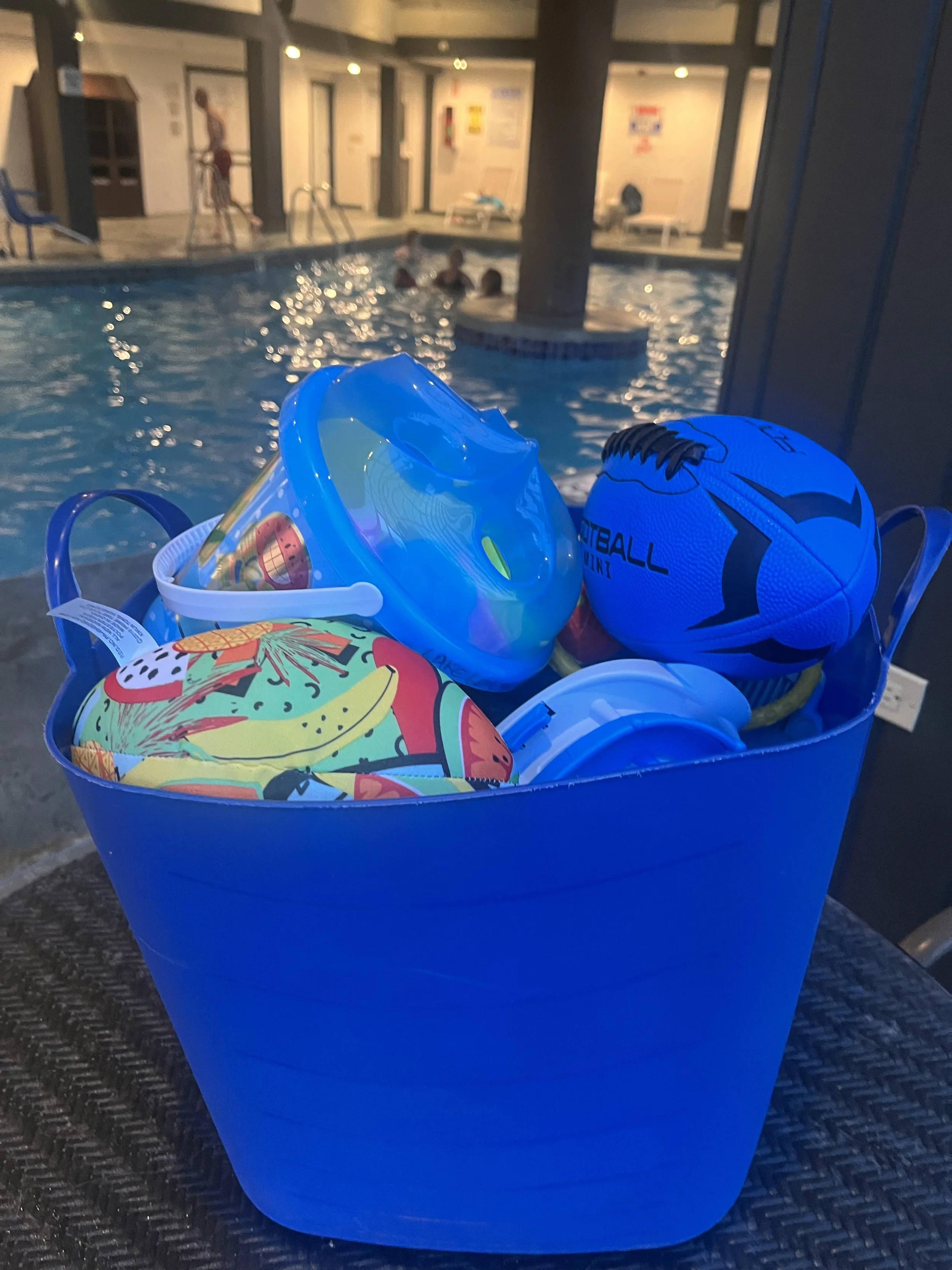 Bucket of water toys for this family staying at The Ridge Hotel in Lake Geneva.