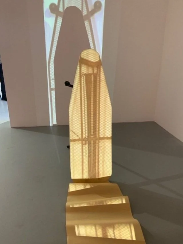 In crease/Im press, found ironing board, butchers paper, projected video, 2019
