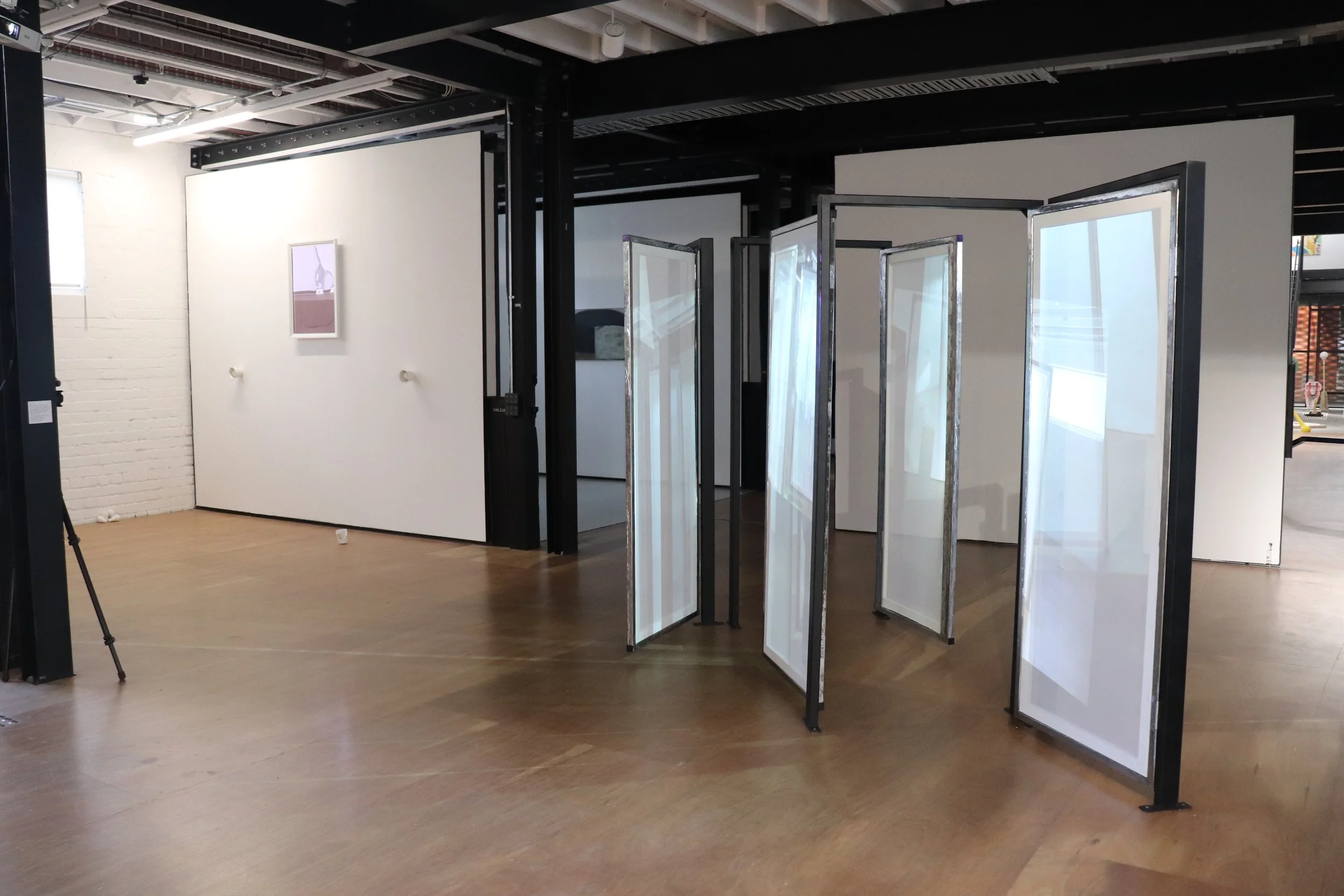 'Moving My Image Through Any-Space-Whatever', centre installation - steel frames, polished steel doors, transparent scrim, live and pre-recorded projection, VCA Stables, 2024
