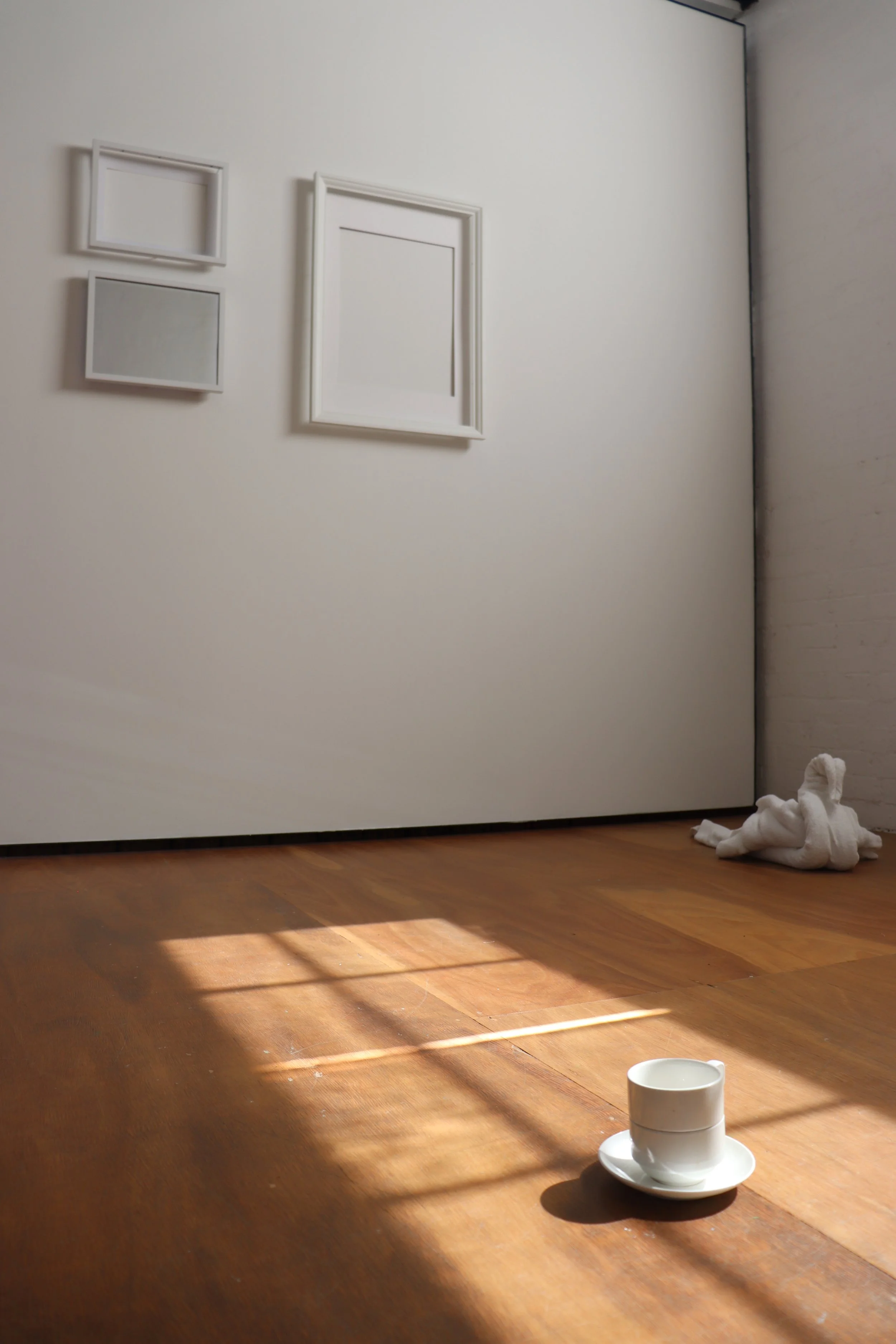 'Moving My Image Through Any-Space-Whatever', towel, readymade frames and mugs, VCA Stables, 2024