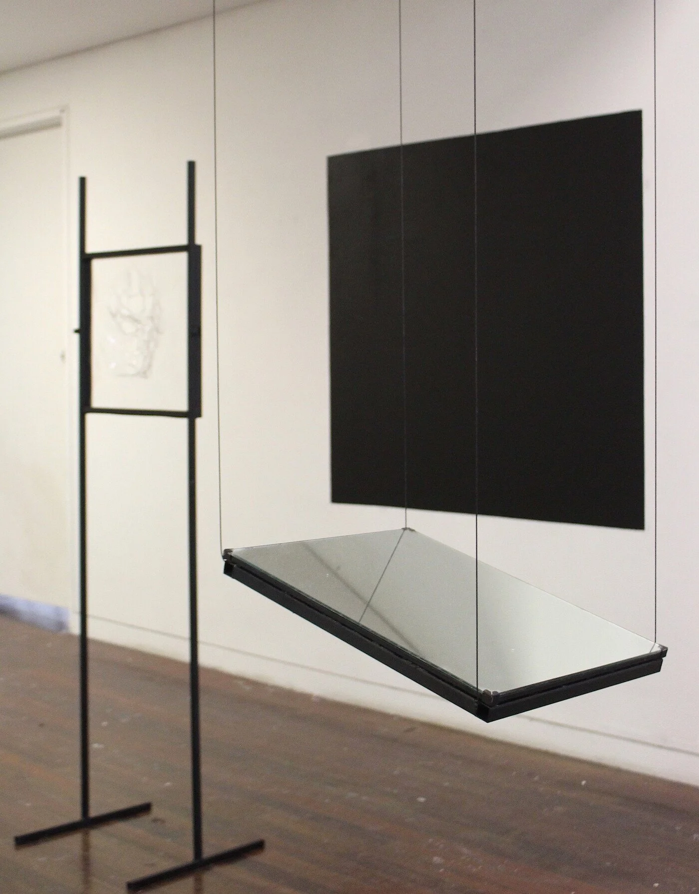 To Sip from the Sweet Cup (swallow the lump of illusion, spit yourself out in shards), Found mirror, wire, square steel structures, acetate, black paint, 2021