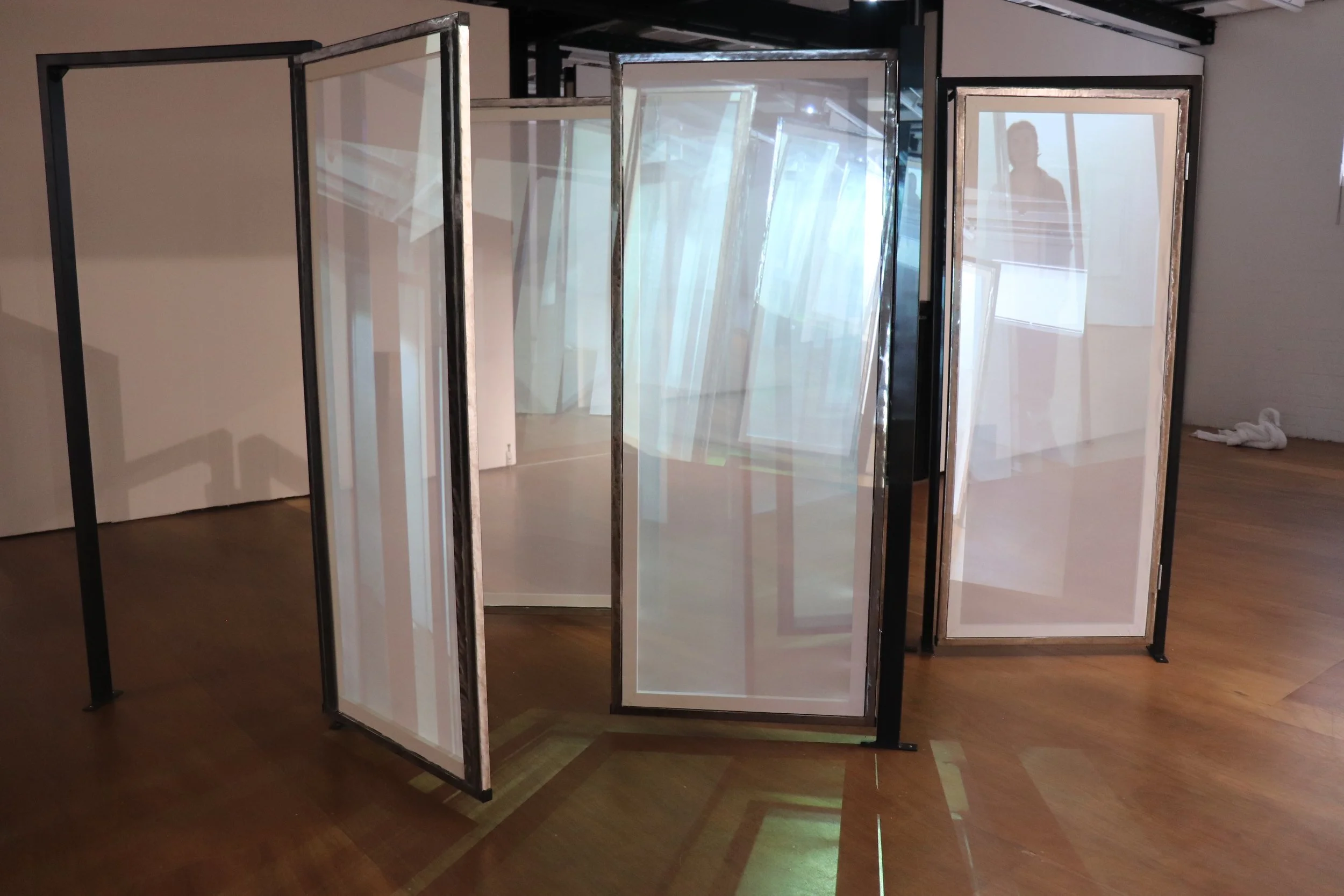 'Moving My Image Through Any-Space-Whatever', centre installation - steel frames, polished steel doors, transparent scrim, live and pre-recorded projection, VCA Stables, 2024