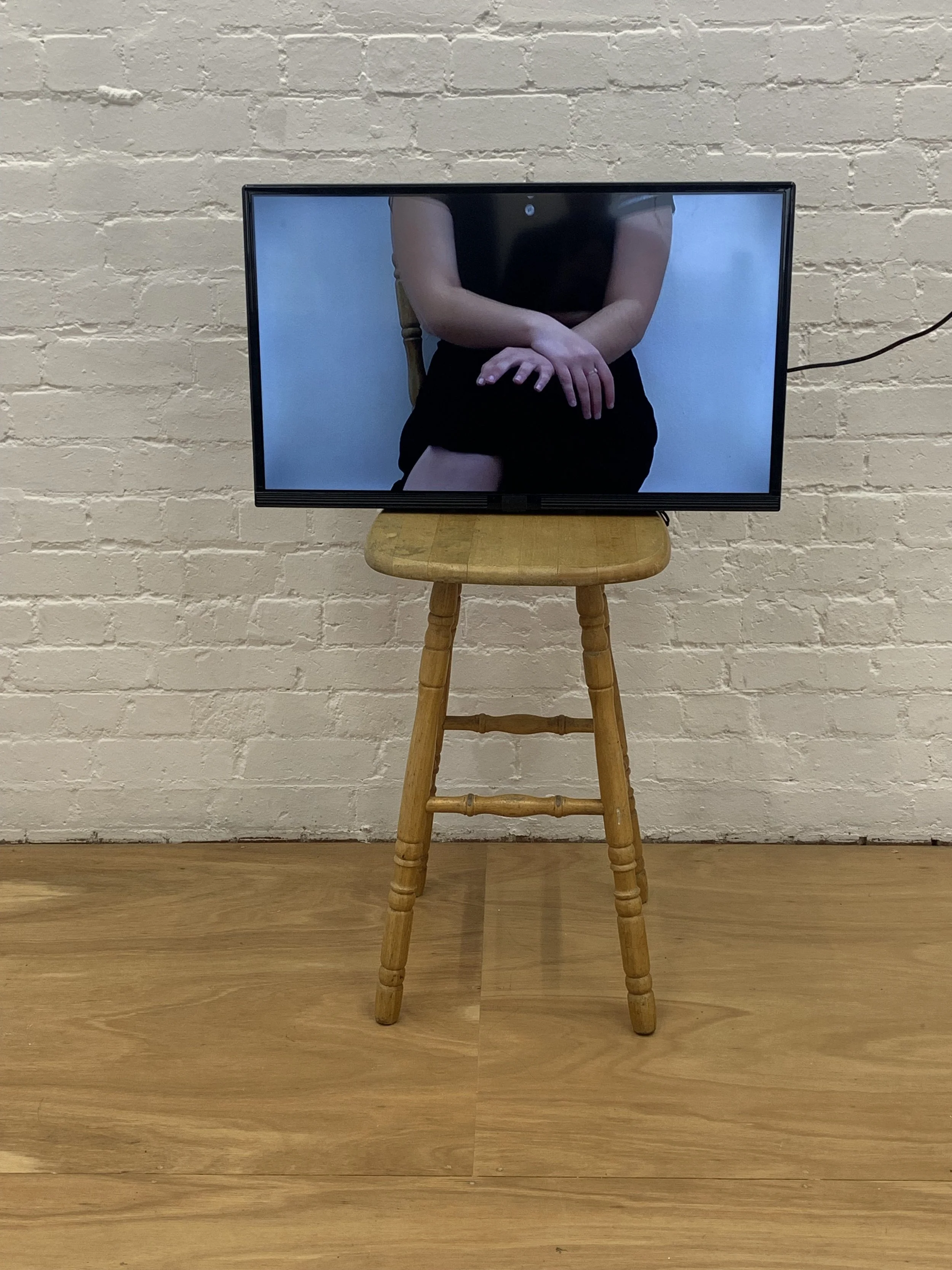                  INT. CHAIR, looped video, chair, 2024