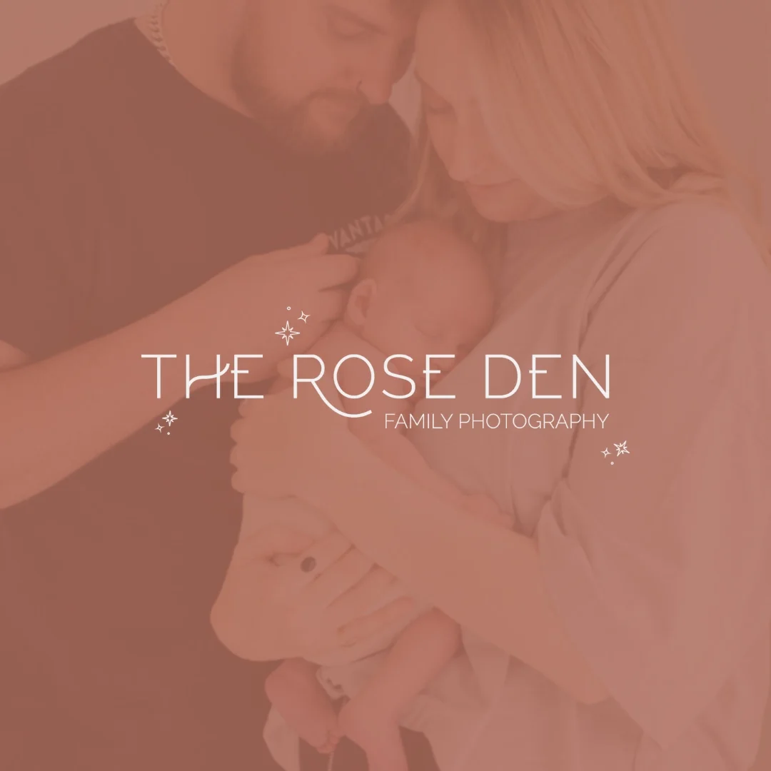 A family holding their newborn baby close together, with a mother and father smiling gently at their child.