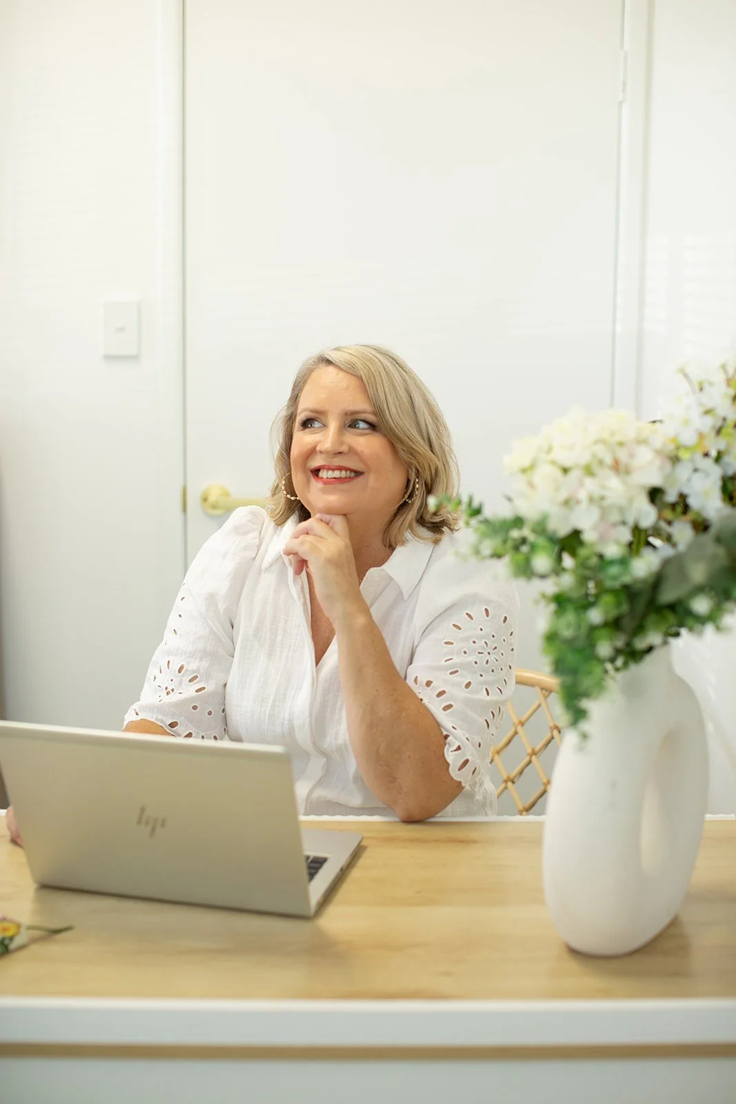 Naturopath Danielle Dennis smiling in a calm consultation space