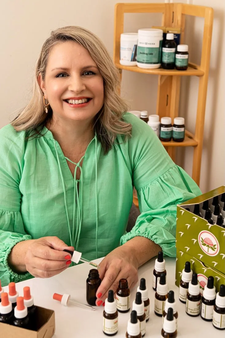 Danielle Dennis, naturopath, standing in her Bargara consulting room