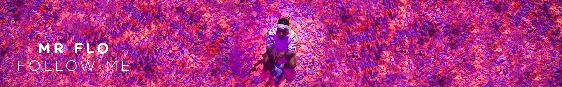 Person crouching in a colorful autumn leaf-covered area with purple and pink lighting, wearing a hoodie, sunglasses, and a cap, with the text 'MR FLO FOLLOW ME' overlayed.