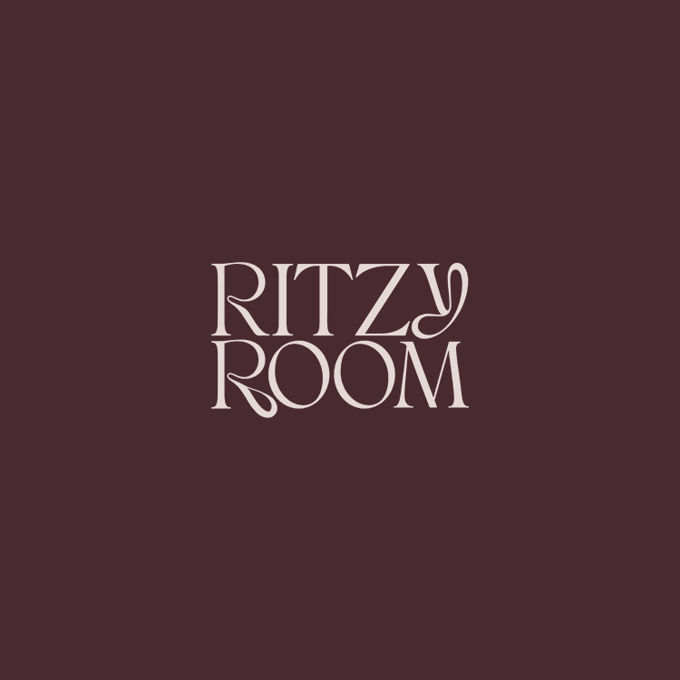 Text that reads "RITZY ROOM" on a dark purple background