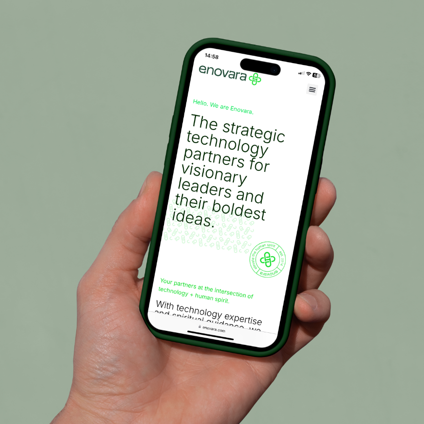 A hand holding a smartphone displaying Enovara's website with a green and white color scheme, featuring text about strategic technology partnerships and innovation.