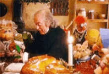 a-gif-of-scrooge-and-the-muppets-eating-a-roast-turkey