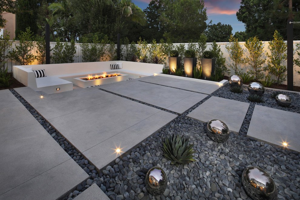Outdoor living design featuring custom pool and patio area