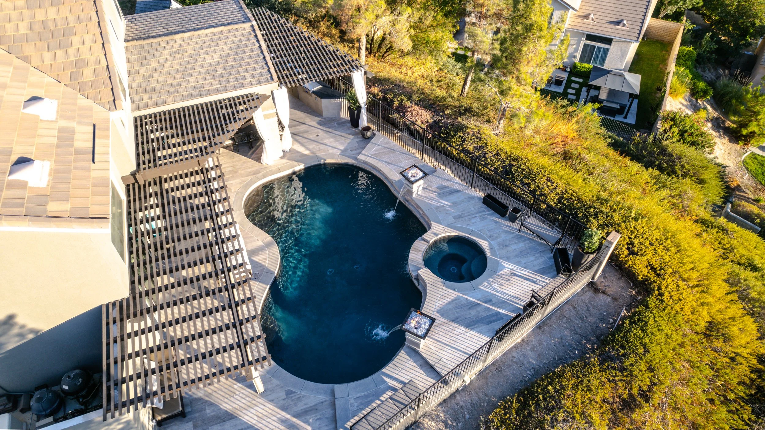 Refined backyard project with pool and outdoor entertainment area