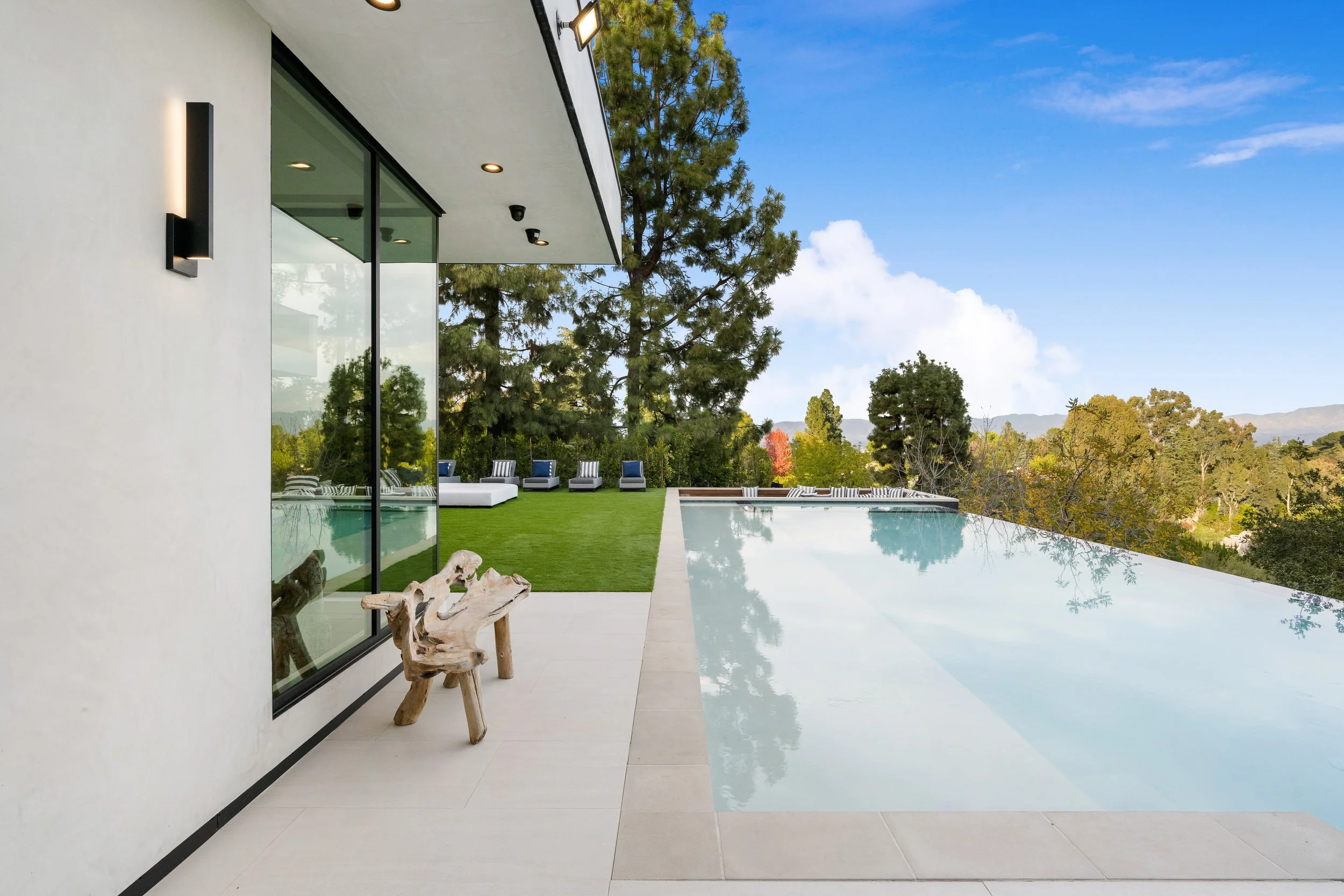 Los Angeles outdoor living space with porcelain tile and custom pool