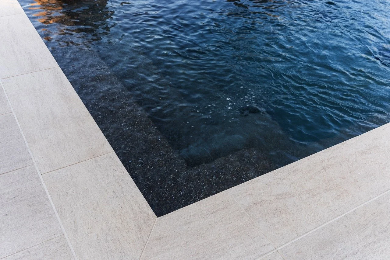 Contemporary backyard pool deck and fountains renovation in Los Angeles by Lonestar Builders