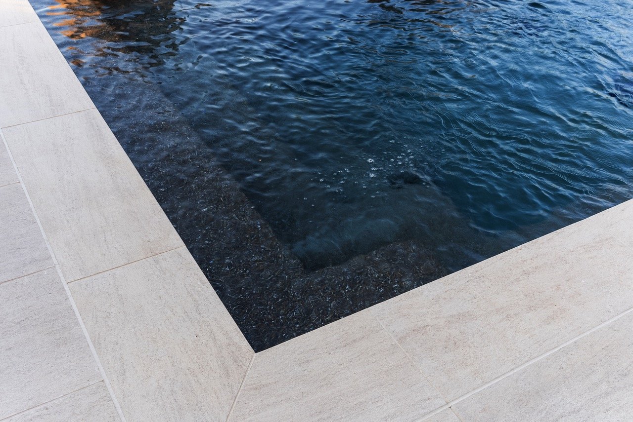 Contemporary backyard pool deck and fountains renovation in Los Angeles by Lonestar Builders