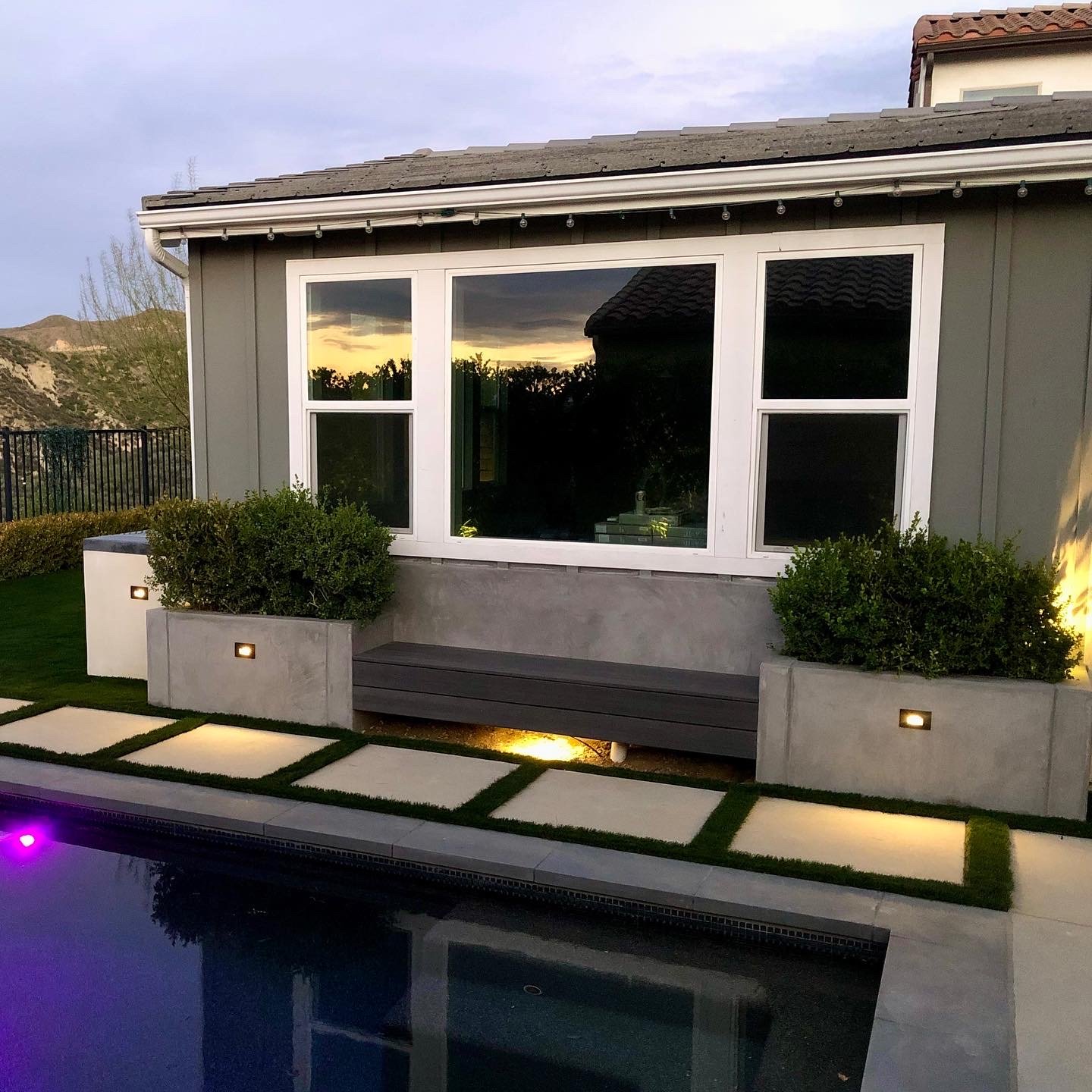 Custom backyard renovation with pool, patio, and landscape design