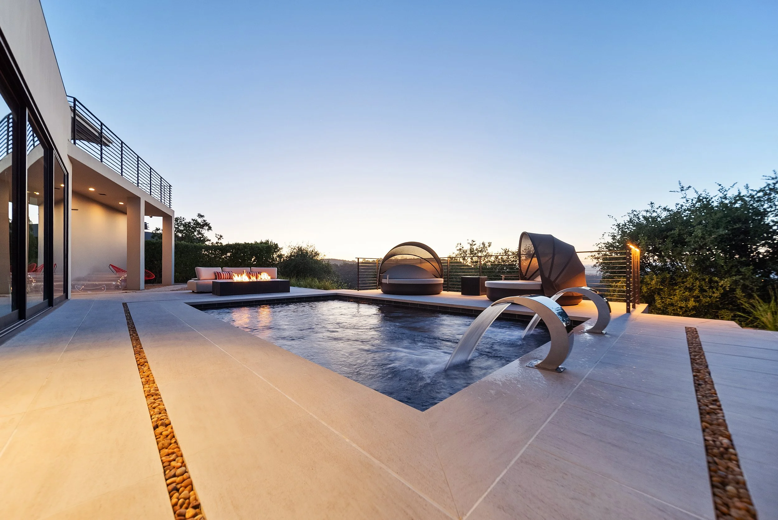 High-end backyard project with pool, seating, and landscape design