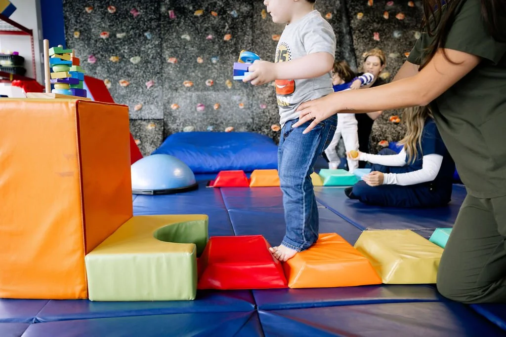 Child working with occupational therapist in New Jersey to build posture, movement, and sensory skills for confident eating, breathing, and speaking.